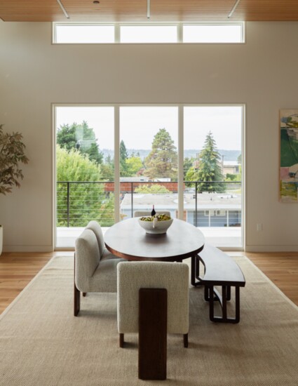 Large windows allow for ample natural light and views in the dining room. 