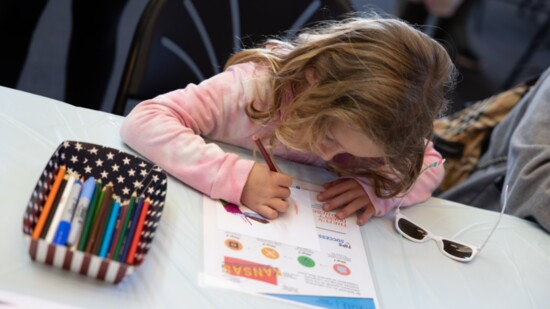 A child make a Kansas-themed drawing to be made into a tile.