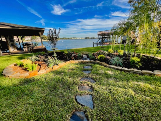 Pathways and lanscaping create interest on the lakeview from the yard. 