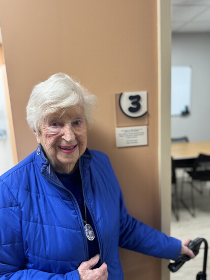Patricia Dupuis Casey, 98, of West Hartford in front of Room 3 at the House of Bread’s Education Center, which was dedicated in her honor.