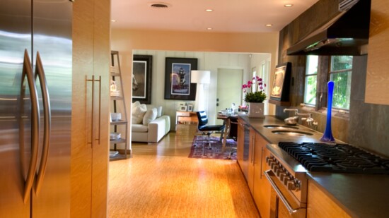 Cabinets with a simple finish and slim hardware keep this galley-style kitchen fuss-free. Photo by Sergio Santos