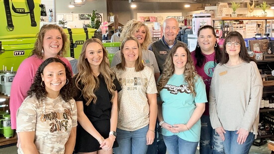 Owner Lynsey Todd (back left) and the Monograms Plus team