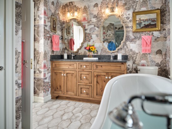 This powder room boasts pops of pink amongst a lovely beige background