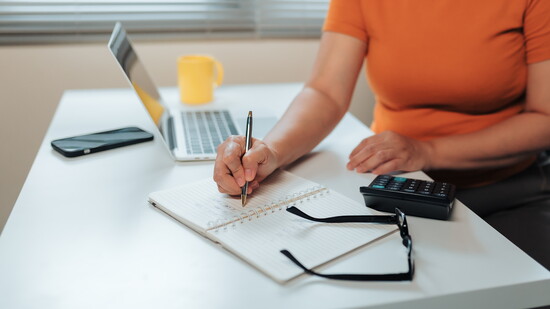 Person doing calculations.