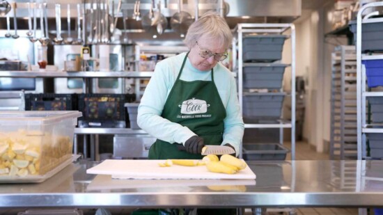 Volunteer, Mary Dionne, Chopping Squash