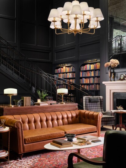 With two wrap-around staircases, the Library welcomes guests to gather among book-lined walls. Photo courtesy of Magnolia Discovery Ventures, LLC 