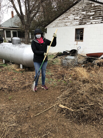 Laura Browarny, Culture Supervisor of the TOW Museums, helps tidy up the landscape of the Historic Halfway Homestead site.