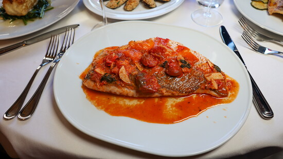 Fresh Sea Bass Acquapazza Poached with Cherry Tomatoes, Basil, and Garlic