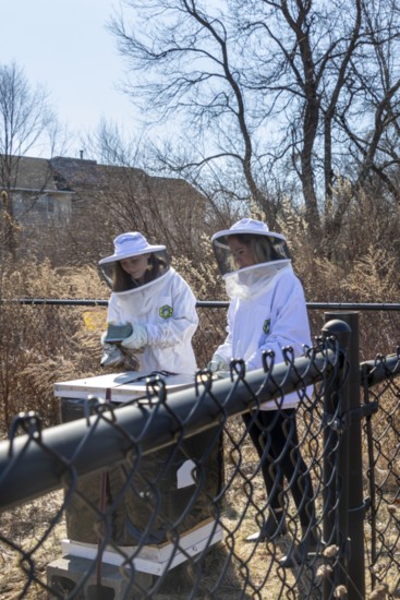 Beekeepers Kathryn Cabrera and Kaylah Birmingham