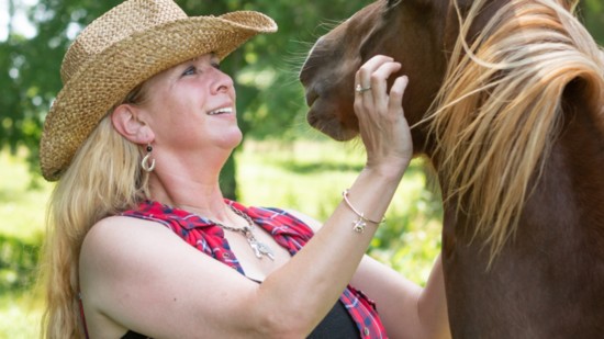 Rachel McAuley has a playful encounter with her rescue horse Liza.