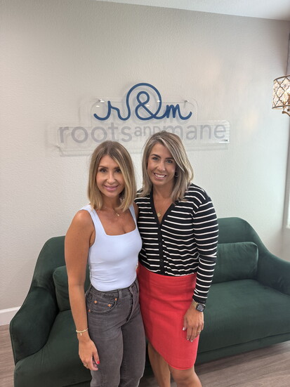 Mayor Harmon with her sister at their Lone Tree salon