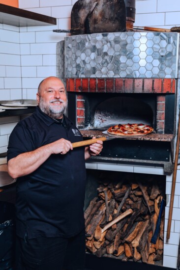 Chef Ralph Sdao at Nello's Italian wood-fire pizza oven.