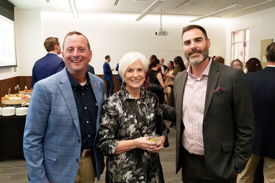  Business leaders posing for the Chamber's photographer
