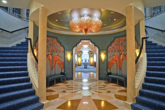 Inlaid marble floors and Art Deco-inspired bird murals welcome guests to the downstairs entertaining space.