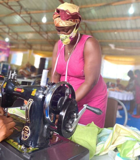 Ghanaian woman learns how to sew in the Wo Ye Bra program.