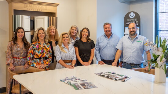 Tim (middle) and Jillian (to his right) pose with their teams