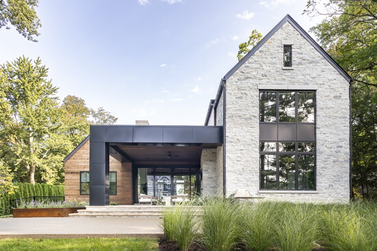 The back view: “I love the natural stone and wood siding meeting the more industrial steel — it’s really beautiful,” La Marco says.