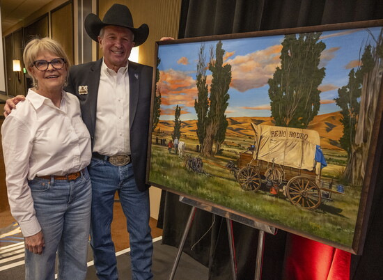 Cathy Trachok and Jim Neil at the poster unveiling for 2025