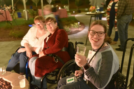  residents at Champions Place hanging out by the fire pit