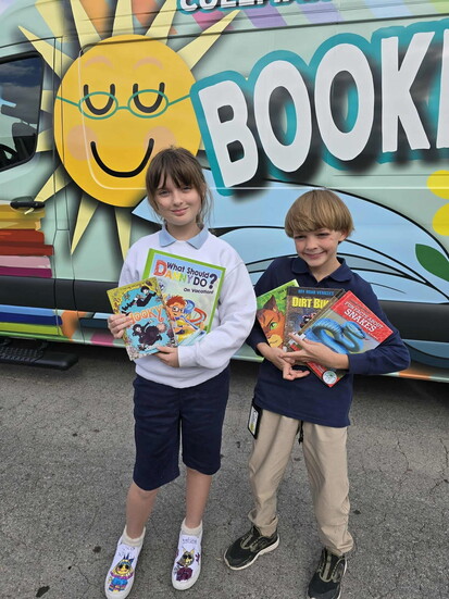 The Cullman County Public Library Bookmobile serves as the library for Cullman Christian School. Pictured are students Willow and Jonah. 
