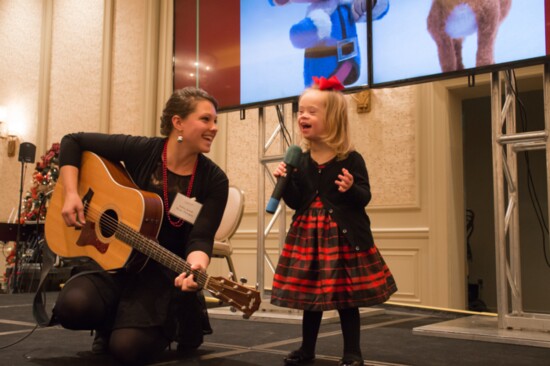 One of APTB's young clients performing with her music therapist Ashley Gant