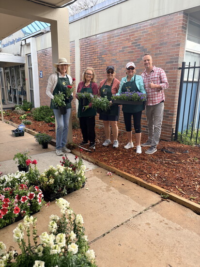 Volunteers come together to cultivate the Cheryl Laurel Garden Club.