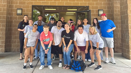 Staff, Villagers, and volunteers celebrating The Village Centers' Family Picnic event.