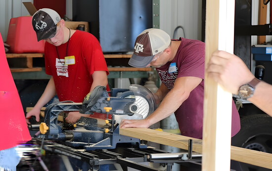 Sleep in Heavenly Peace volunteers build a child’s bed.