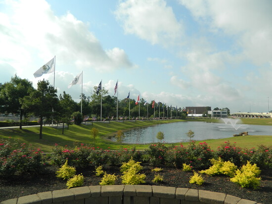 Flags lining the path among park monuments.