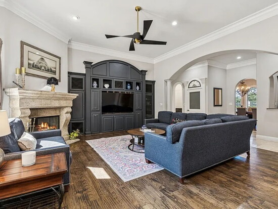 The den off the kitchen ready for family game by the fire.