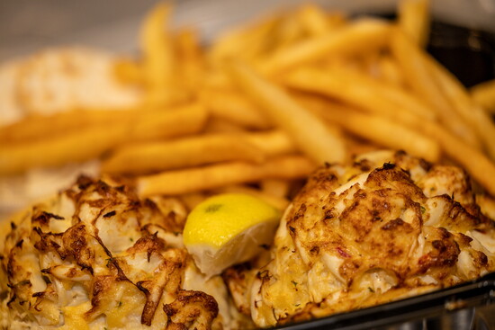 Crab cakes and french fries. Photo Credit: Kerry Paradis Photography