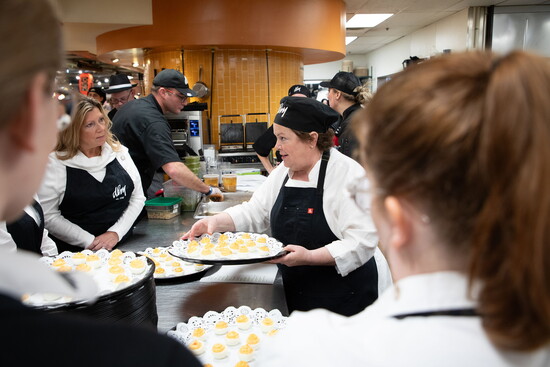 Chef Carrie Walters preps the team at the DLM Food & Wine Show. Photo By: Tracy Doyle