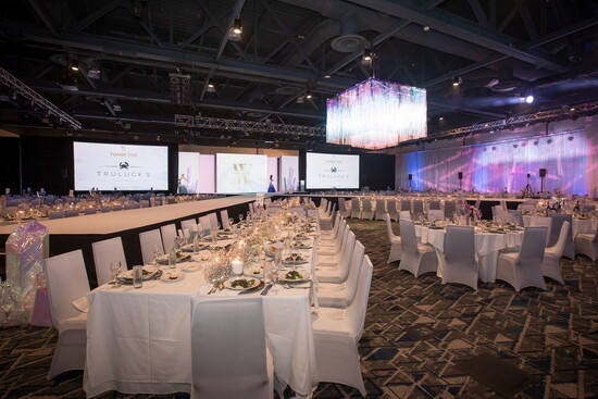 Set for the evening: elegant tables await guests for a night of fine dining and fashion. - The Walk, 2024.