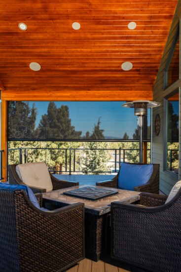 Custom retractable screens offer protection from harsh winds and help retain heat from patio heaters creating an outdoor living space.