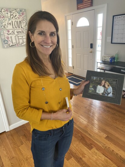 Melissa Holds a Photo of Herself with Rachel