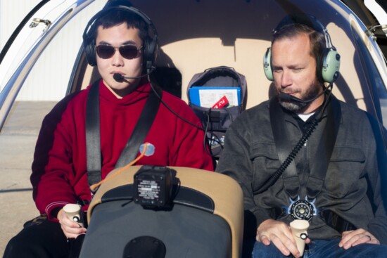 Matthew Bergthold, program manager, U.S. Army veteran and Certified Flight Instructor, with OU aviation student during a pre-flight check