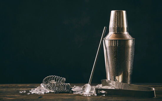 Cocktail shaker, tools, and crushed ice. 