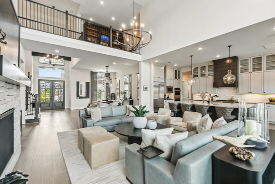 The open-concept layout connects the living room, dining area, and kitchen in seamless style, making everyday living feel extraordinary.