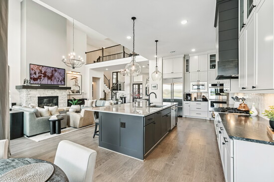 Cook, entertain, and connect without missing a moment in this open kitchen overlooking the great room.