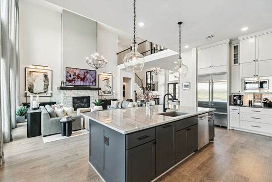The open-concept layout connects the living room, dining area, and kitchen in seamless style, making everyday living feel extraordinary.