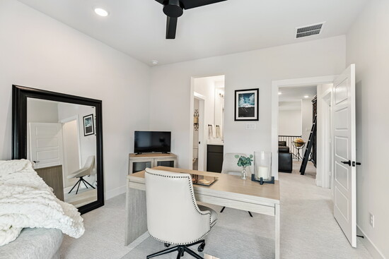 A fourth bedroom easily converts into a private office or study, with a large window overlooking the neighborhood.