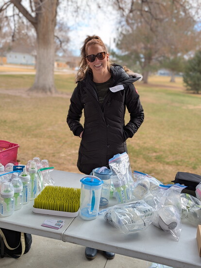 Kyria Brown, CLC with NoCO Doula Collective, distributes nursing support items and answers infant feeding questions at the Spring Stroller Event
