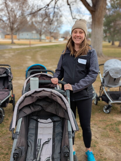 Maggie Clayton with KinderThrift NoCO cleans and prepares strollers for families attending Stork Support’s Spring Event