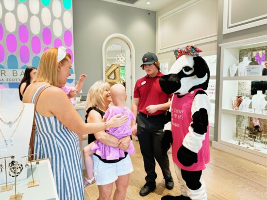 Olivia meeting the Chick-fil-A cow