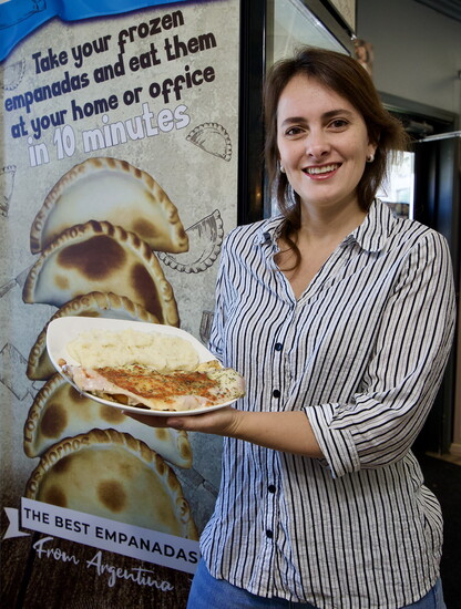 Isolina María de la Vega with Milanesa, Lionel Messi’s favorite food. Photo by Bruce N. Meyer