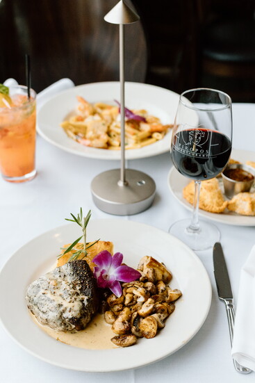 Peppercorn steak, shrimp and scallop pasta and empanadas at Piropos