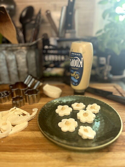 These ‘cheese daisies’ are made with mozzarella cheese cut out with a small flower cookie cutter and finished either a dab of mustard in the center.