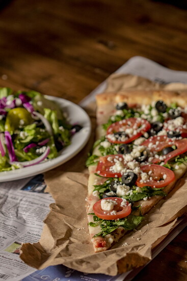 Giant pizza by the slice, with salad combo