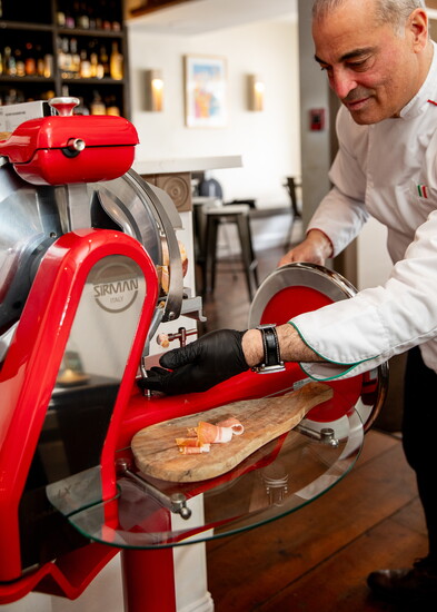 Vittorio Lanni using the prosciutto slicer