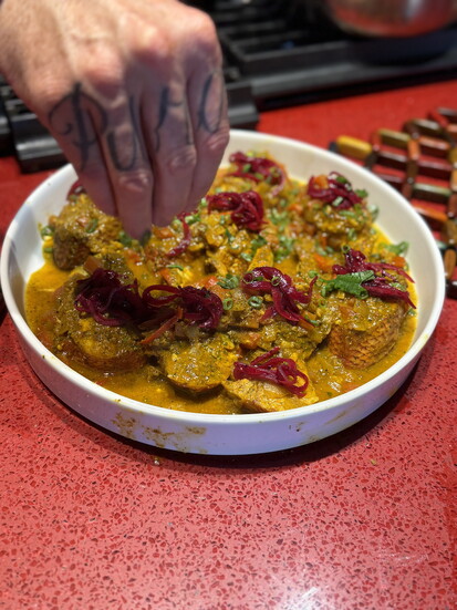 Garnishing fish curry, The Xperience private chef lunch